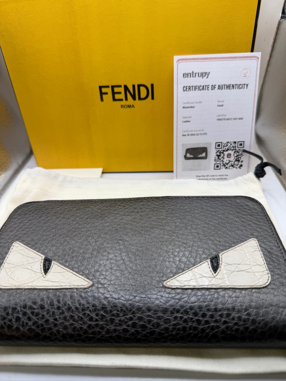 Fendi Black Leather Zip-Around Wallet with Cream Eye Detail. All inclusive. COA
